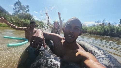 Selfie, swimming and friends in lake for fun on holiday, summer vacation and weekend