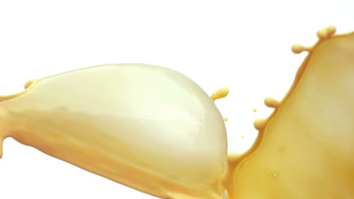 Yellow Liquid Splashing in Slow Motion on White