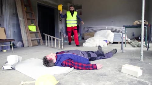 Construction Worker Injury, Colleague Responds in Unfinished Building