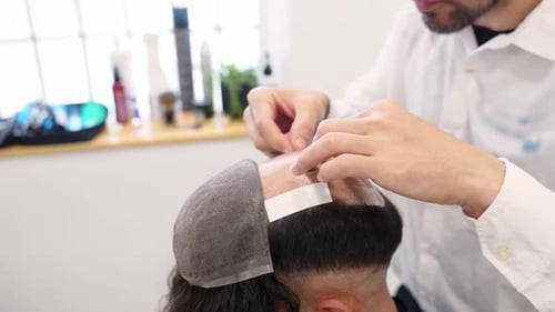 Hair System Application Slow Motion Close Up of Hair Patch Placement
