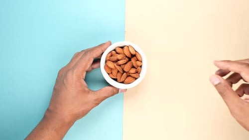 Top View of Hand Pick Almond Nuts