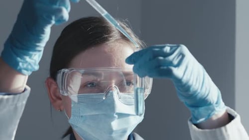 Young Adult Scientist Working in Lab