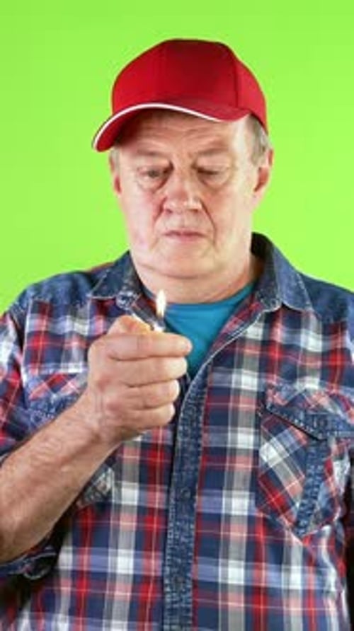 Man Lighting Lighter on Green Screen Background