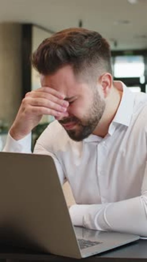 Sad Businessman Using Laptop Loses Becoming Shocked Sudden Lottery Results in Modern Hotel Lobby