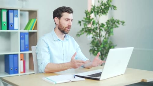 Professional Man Video Calling From Office Desk