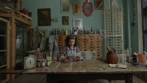 Woman Counting US Dollars Money In Workshop