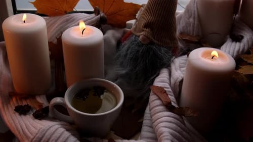 Cozy Scene with Candles and Autumn Decor