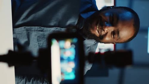 Man Recording Video in Studio at Night