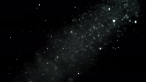 Dust particles floating under light