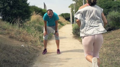 People Running In Park, Tired Man Taking Break, Super Slow Motion 240fps