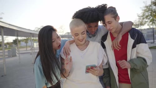 Group of Happy Friends Using Phone and Having Fun in the Street Teenagers Sharing with Mobile Cell