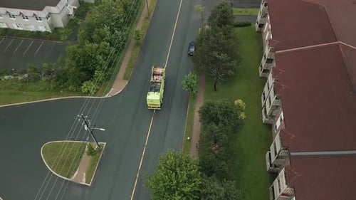 Aerial View of a Garbage Truck Loading Garbage in the City