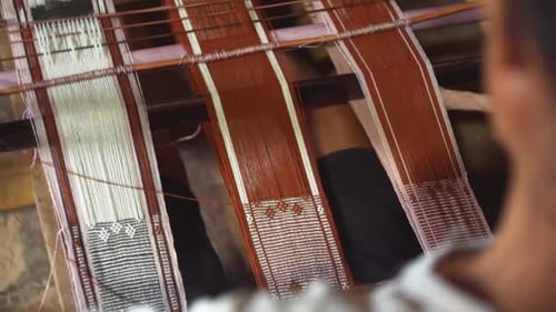 Weaving Colorful Yarn on a Traditional Wooden Loom