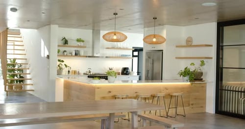 On start, camera is panning left revealing wood kitchen island and bench, showcasing layout