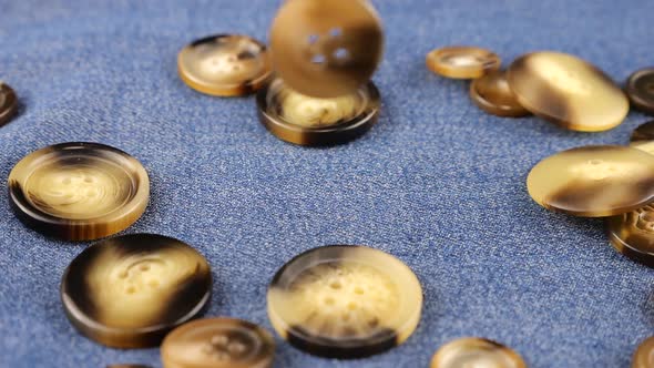 Buttons Falling onto Blue Denim Fabric, Slow Motion Stock Footage ft ...