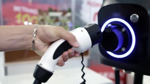 EV Charging Plug Connecting to Futuristic Station