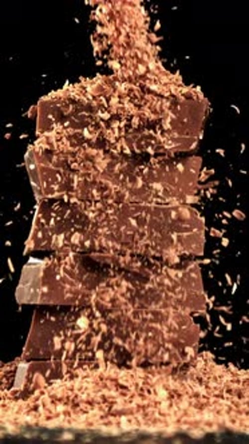 The Grated Chocolate Falls on the Chocolate Slices Filmed on a Highspeed Camera at 1000 Fps
