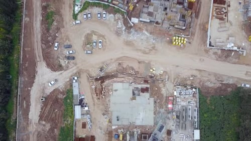 Construction site with moving Cranes, Aerial view