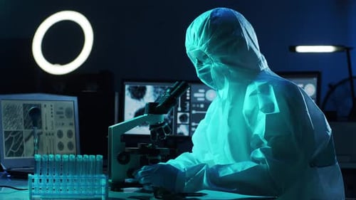 Scientist Working with Microscope in Modern Laboratory