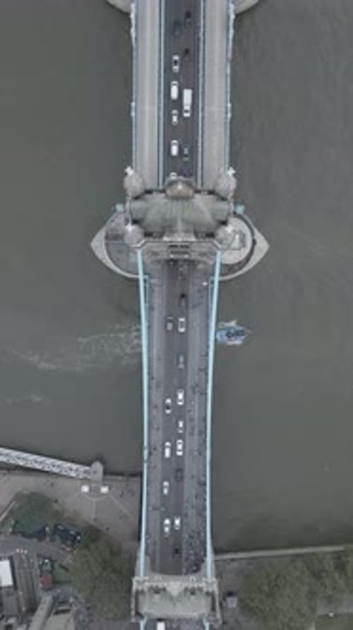Aerial video of the city of London and the lighthouse bridge in London at night