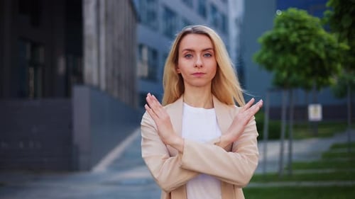 Girl Crosses Arms Advises Client to Avoid It and Not Make Mistakes