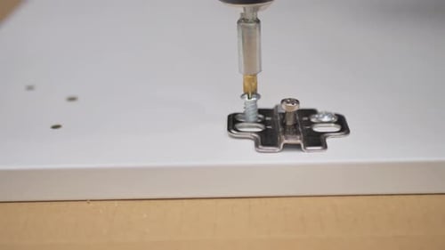 Using Power Drill on Furniture Close Up