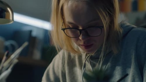 Young Woman Creating Art Indoors Close Up