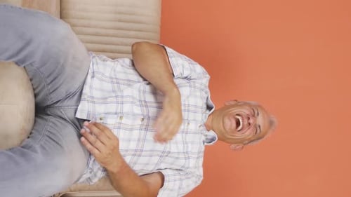 Vertical video of Man with Psychological Problems alone at home.