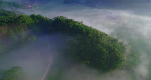 Aerial view of hills with mist surrounding