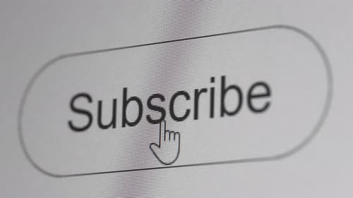 Clicking subscribe button on the computer screen