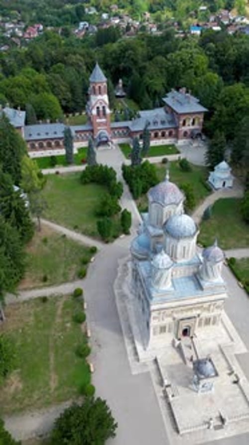 Curtea de Arges Monastery, aerial perspective. Beautiful green landscape. Mountains in background. F