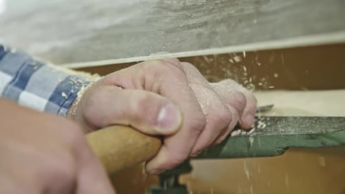 Close Up of Mans Hands Using Manual Timber Lathe