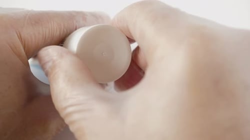 14. A small amount of cream is squeezed onto the spatula. Concept of cosmetology.