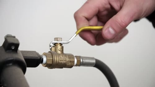 Opening and Closing a Brass Industrial Valve