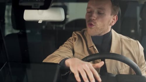 Young Adult in Car Talking About Dashboard Screen