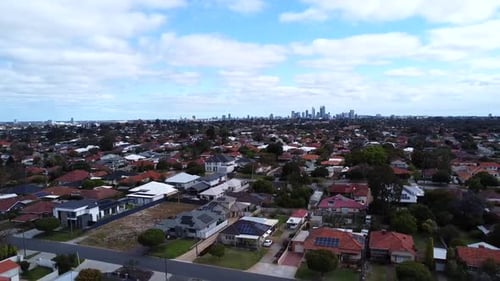 Aerial view motion speed change - Perth real estate housing - suburban descending