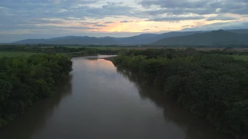 Aerial View of Cauca River At Beautiful Sunset. Pull Back Shot. Valle del Cauca. Colombia