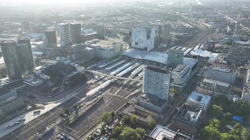 Utrecht central station, public transport and city skyline overview. Aerial drone video