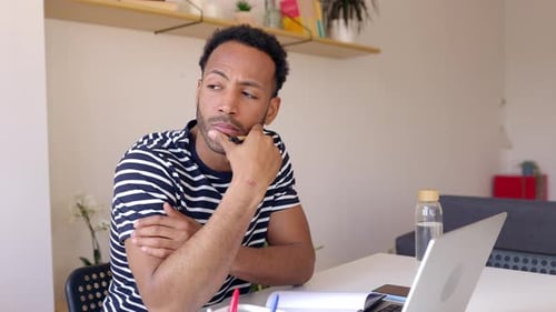 Young Adult Student Man Watching Webinar Video Course on Laptop Computer