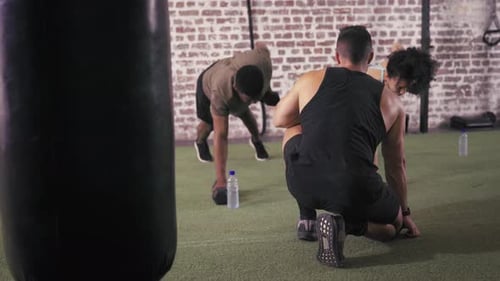 People Doing Dumbbell Rows in Gym