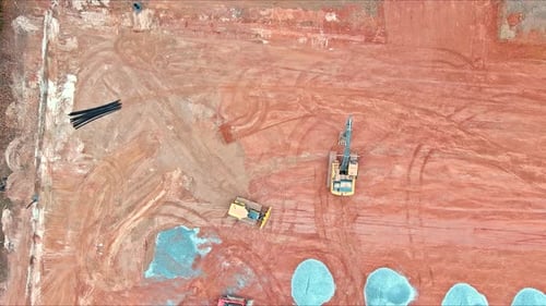 View of a Construction Site From Air Showing Tractors Bulldozers Workers Shaping Land As They Work
