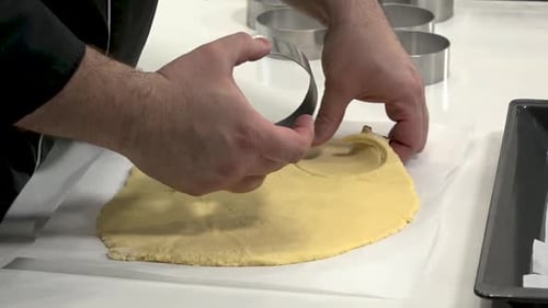 Chef Cuts Dough With Round Cookie Cutter