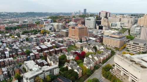 Cinematic aerial establishing shot in Oakland, Pittsburgh, PA, USA. College housing, university rese