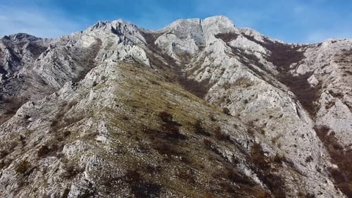 Mountain peak on a sunny day drone shot.