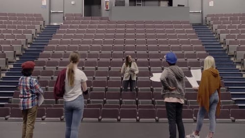 Junior High Drama Teacher Directing Students Rehearsing on Theater Stage Acting