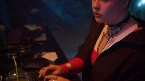 Young Woman Typing on Keyboard at a Desk