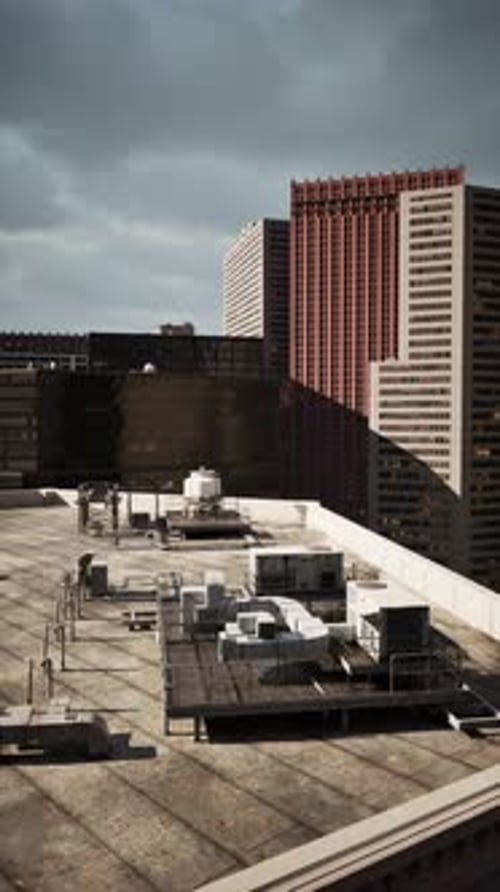 Overlooking Cityscape From Building Rooftop