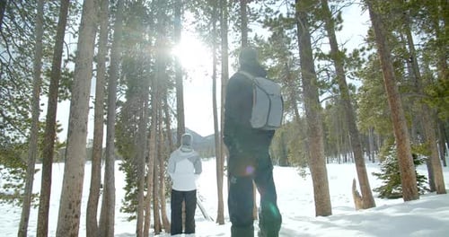 Couple Walking in Rocky Mountain Snow