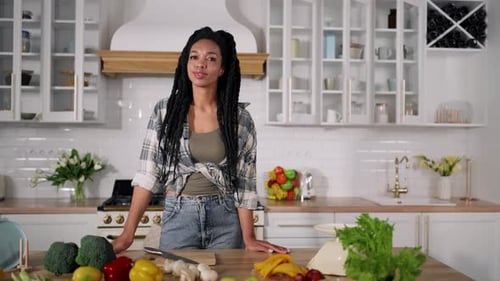 Woman with Fresh Food in a Modern Kitchen