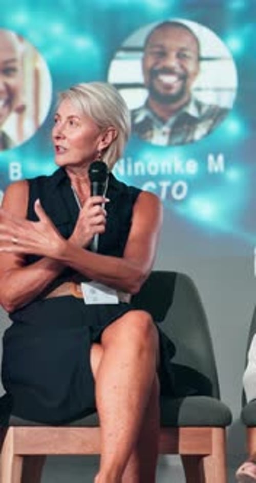 Woman Speaking at a Corporate Conference